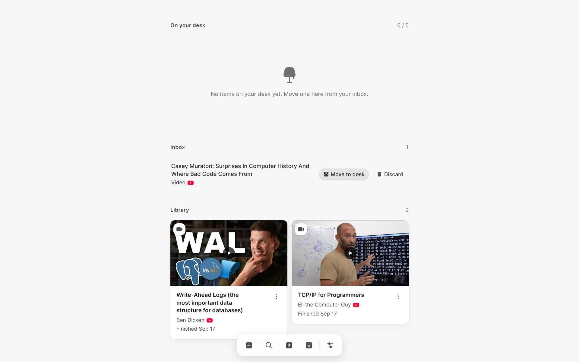 Readr in light mode with an empty desk, an inbox video, and two finished videos in the library